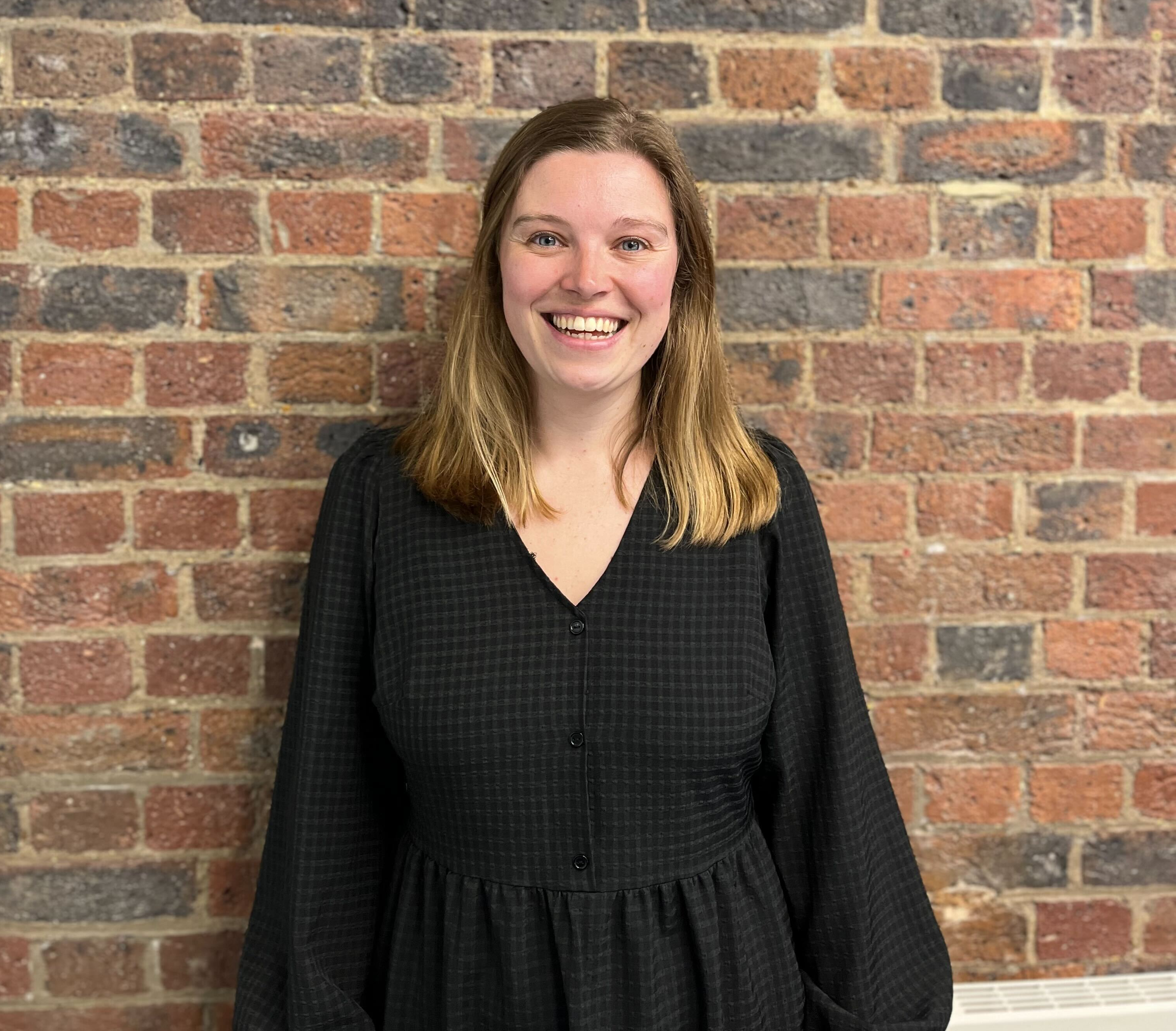 Isabelle Derbyshire in front of Brick Wall